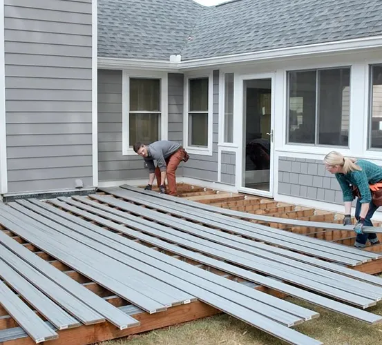 Custom underdeck drainage installation for a dry, functional outdoor space.