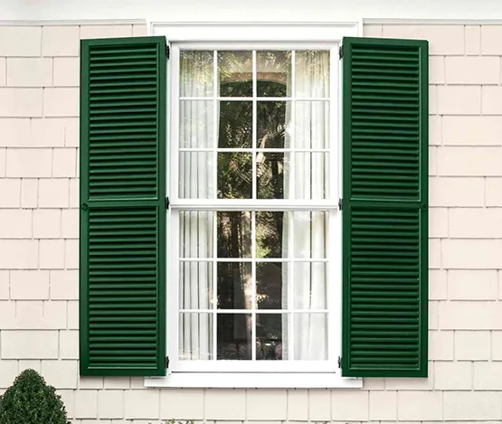 Exterior shutter replacement with modern, durable shutters for a refreshed home look.