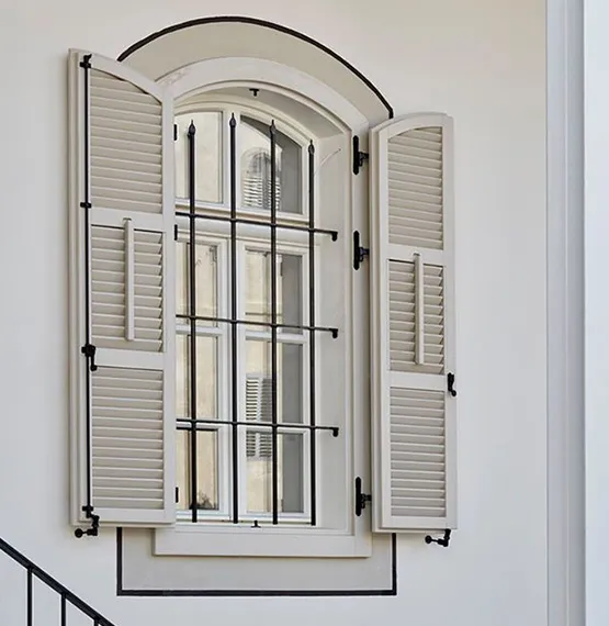 Weatherproof composite shutters are installed for long-lasting durability and style.